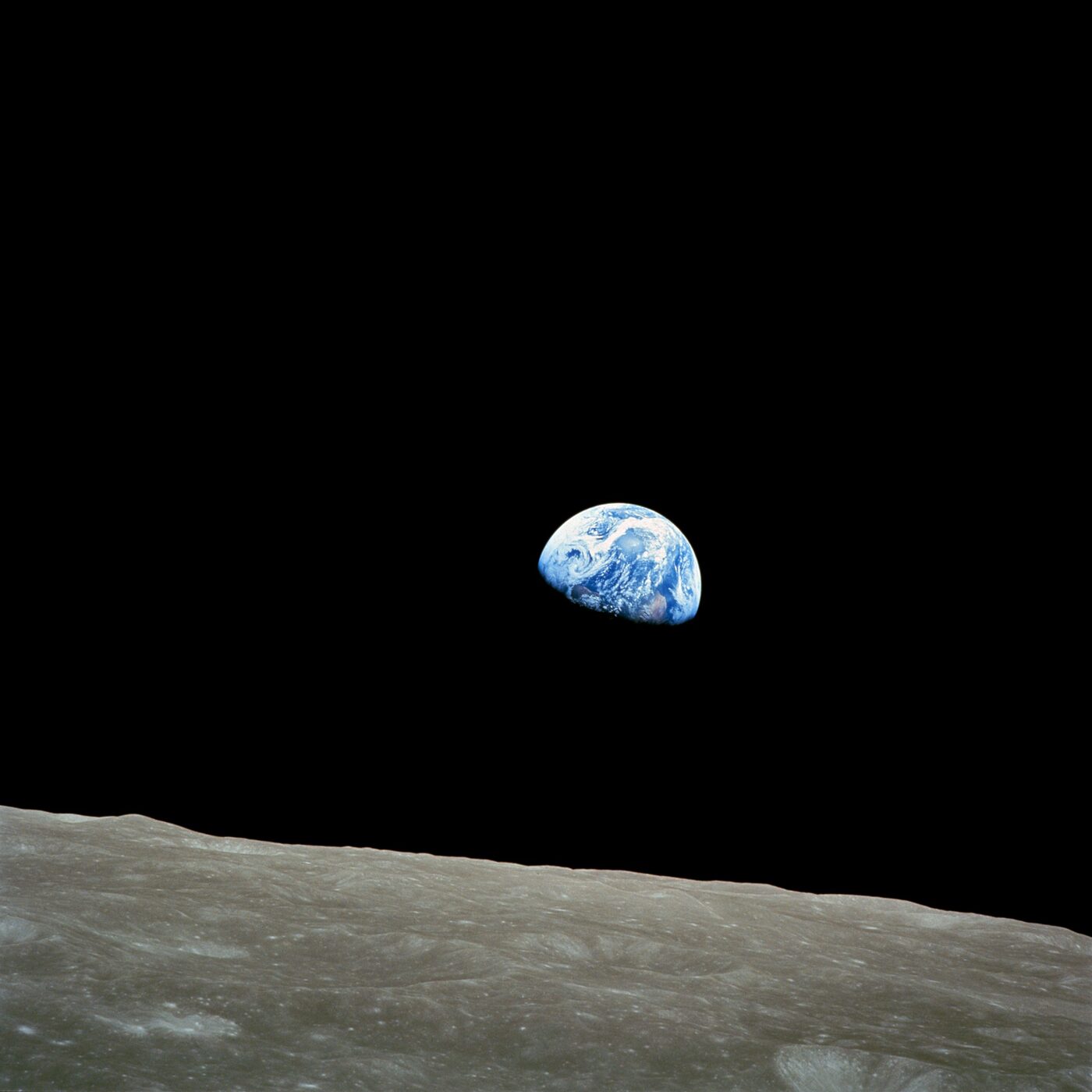 Real photo: Earth rising above the Moon's horizon, taken by Apollo 8